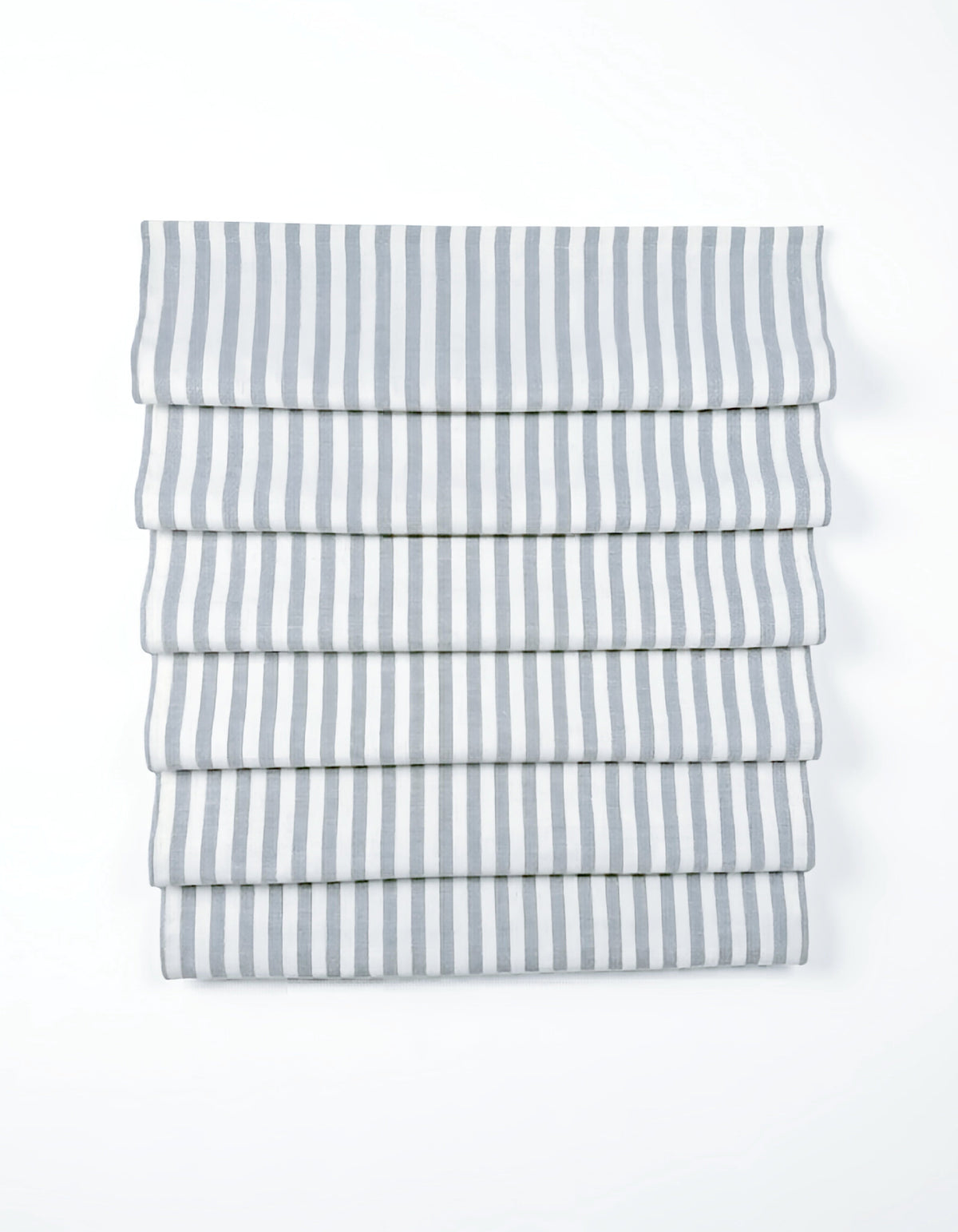 custom hobbled roman shades in white fabric with narrow gray vertical stripes and soft cascading folds