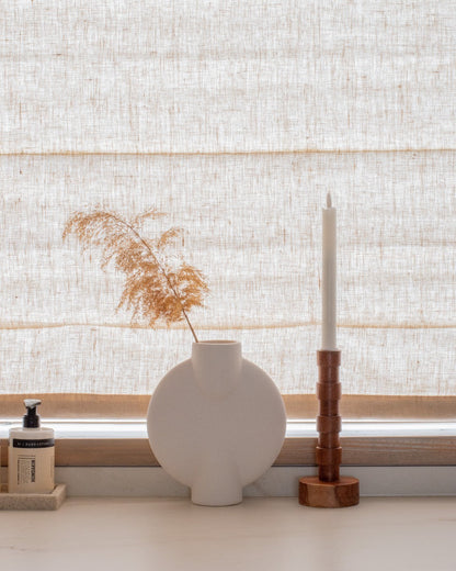 Custom cordless roman shade in natural linen for soft, elegant light-filtering and blackout window treatment