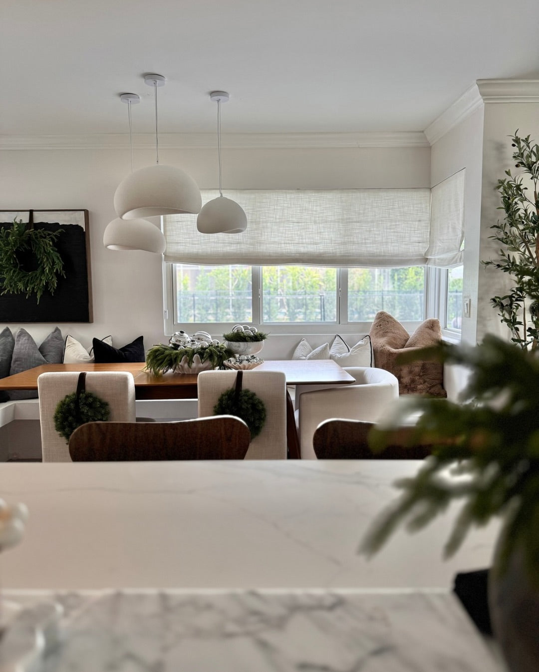 Cordless custom roman shade in natural linen for soft, elegant window coverage with light-filtering and blackout options