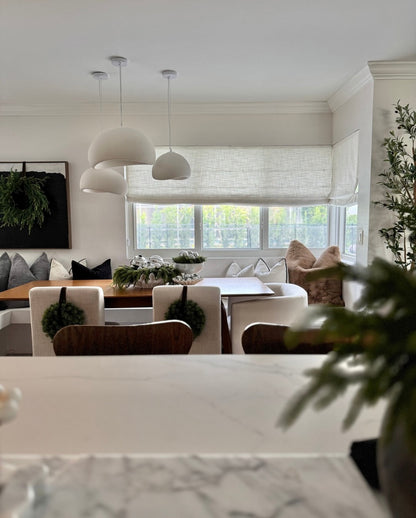 Cordless custom roman shade in natural linen for soft, elegant window coverage with light-filtering and blackout options