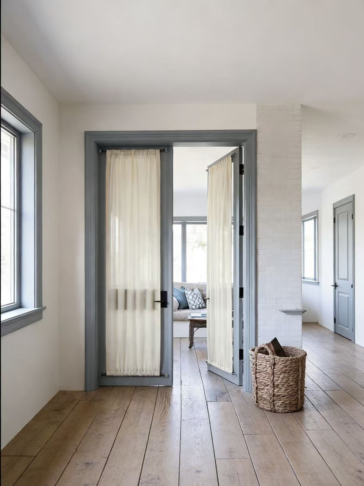 Elegant custom rod pocket french door curtains with sheer fabric providing privacy and natural light.