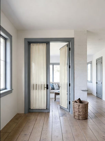 Elegant custom rod pocket french door curtains with sheer fabric providing privacy and natural light.