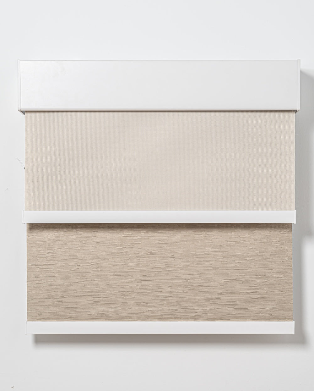 Double roller blinds with sheer and blackout layers in slim headrail for bedroom light control