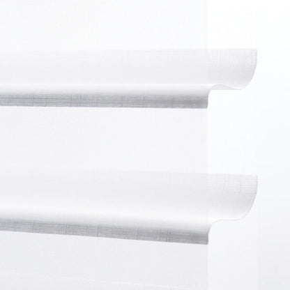 Light-filtering sheer shades with adjustable blades for windows in a minimalist design.