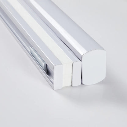 Close-up of cordless top-down bottom-up honeycomb shade mechanism in white and chrome finish for eco-friendly window treatments