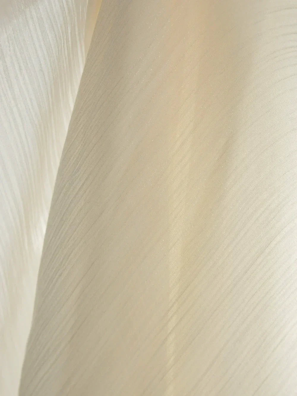 Luxury Galaxy sheer curtains with shimmering threads in a sunlit room