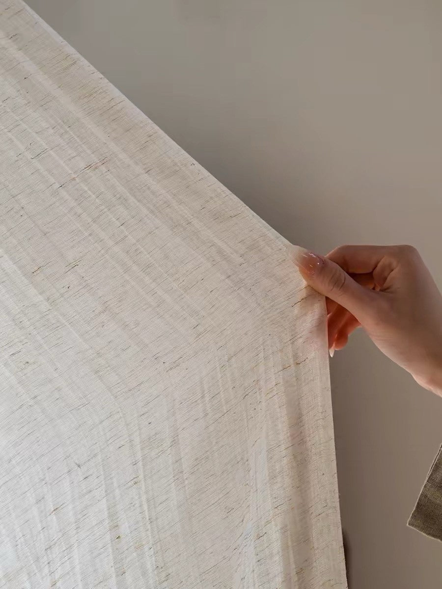 Gauze curtains in a pale natural linen-blend fabric, with a lightweight drape and fine, irregular crinkled texture.