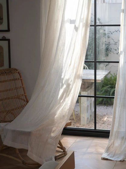 Gauze curtains in sheer ivory linen-blend fabric with fine, crinkled waves and a lightweight, airy drape
