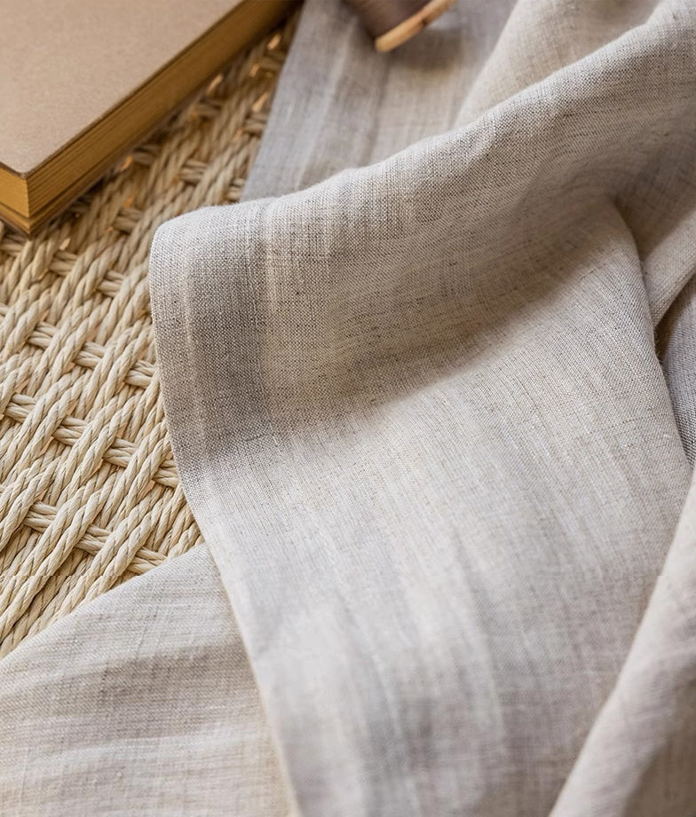 Natural beige linen curtain panels made from 100% French flax fabric with airy texture and elegant drape