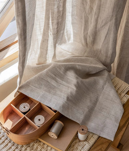 Natural beige linen curtain panels made from 100% French linen with an organic texture and elegant drape