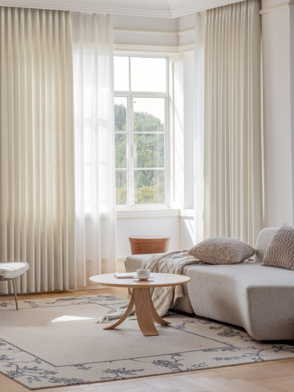 Elegant luxury French linen curtains and drapes in white, pink, light haze blue, and light gray-green with natural texture and soft, relaxed drape