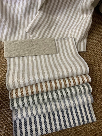 Classic linen striped curtains with French-style ruffled top in a modern home setting
