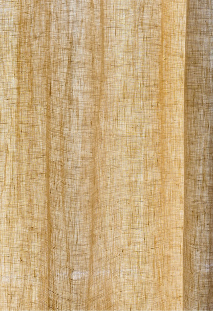 Mustard yellow curtains made of 100% French linen with a soft, muted texture and natural elegance.
