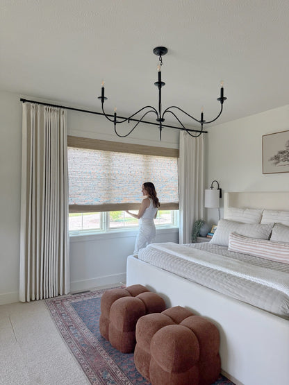 Natural Ramie Bamboo Roman Shades in beige, woven with a textured natural-fiber pattern and a roll-up design.