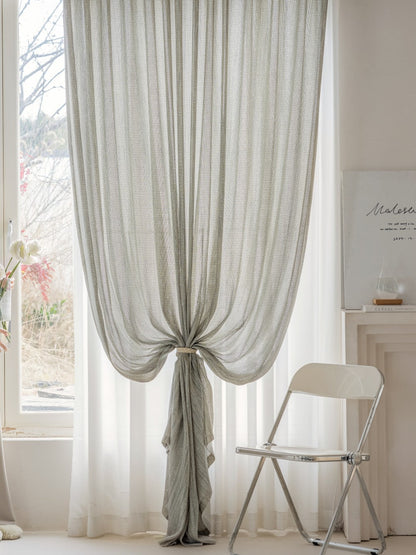 Smoky green net curtains made from German-imported linen cotton blend with sheer, airy texture and mountain mist inspiration