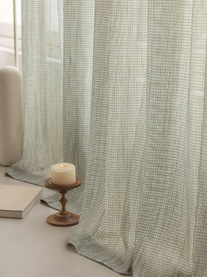 Smoky green net curtains with mountain mist design made from German linen cotton blend sheer fabric