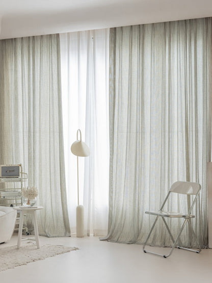 Smoky green net curtains with sheer linen cotton blend fabric imported from Germany, featuring delicate net-style weave and soft privacy