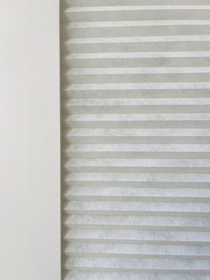 No-drill honeycomb glass door blinds installed on French doors providing insulation and light control