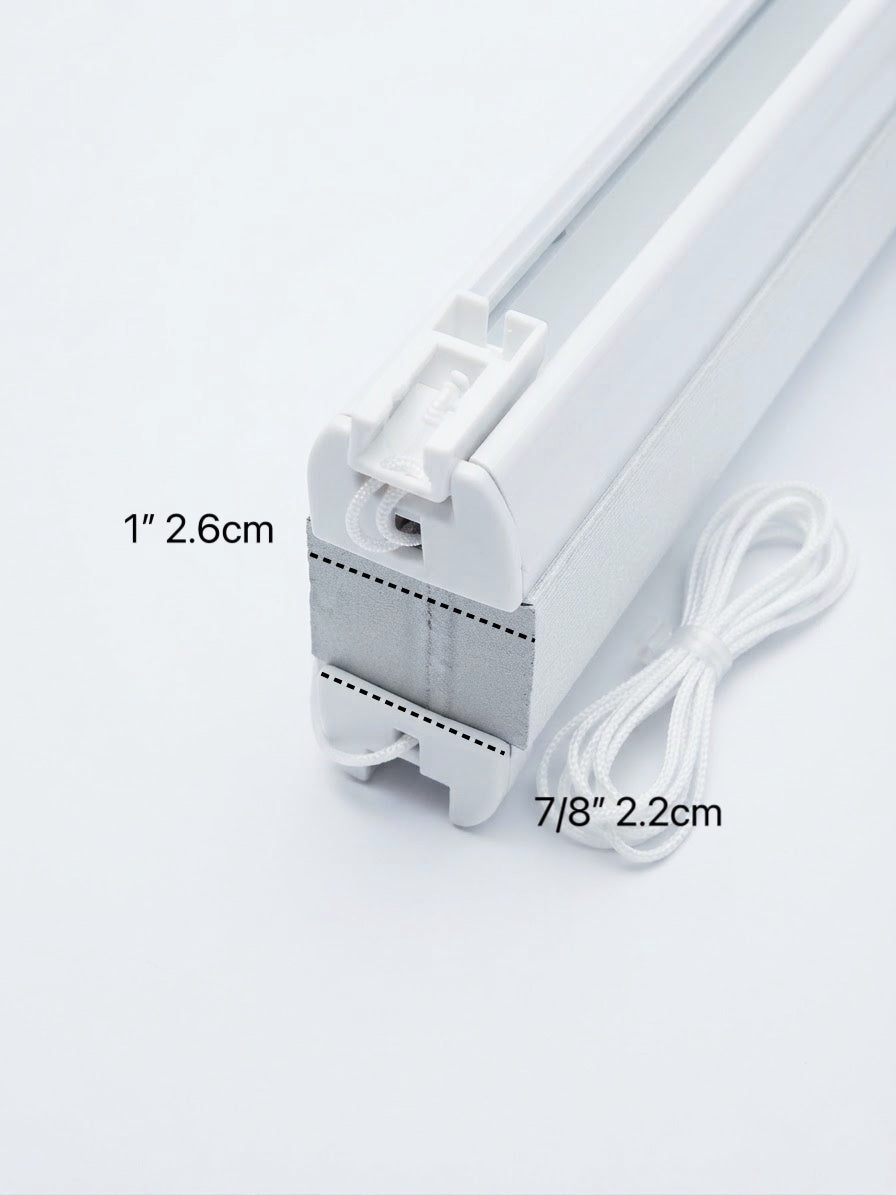 White window shade track end section with overlaid dimension labels reading 1" 2.6cm and 7/8" 2.