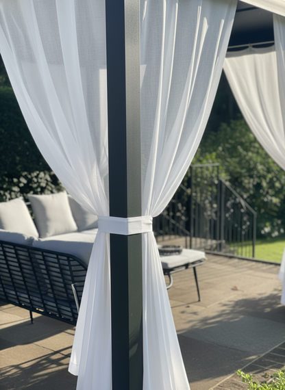 Outdoor curtains on patio providing UV protection, water repellence, and soft privacy with sheer fabric