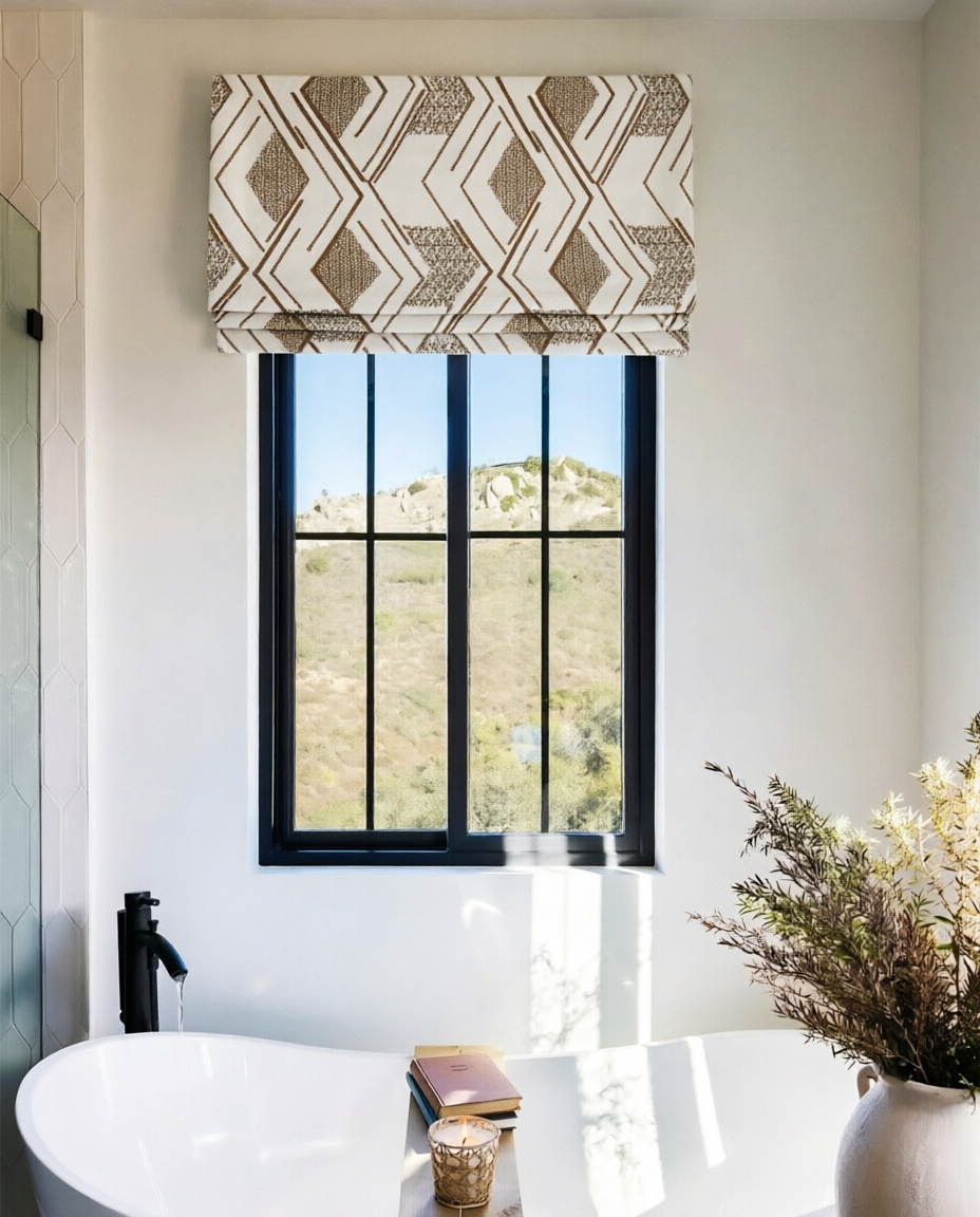 Patterned Roman Shades in cream linen with brown geometric embroidery and a flat fold design for windows