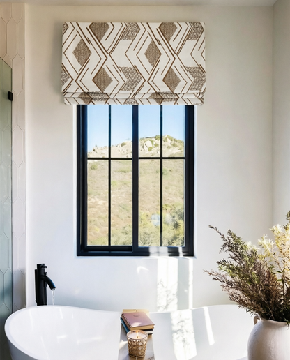 Patterned Roman Shades in cream linen with brown geometric embroidery and a flat fold design for windows