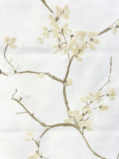 Patterned Roman Shades in ivory linen with raised French embroidery, featuring delicate flowering branches and blossoms