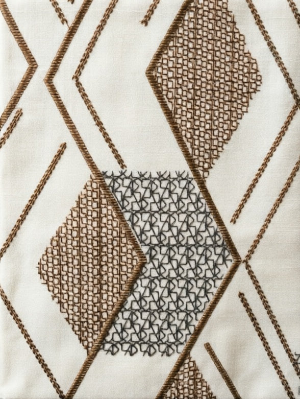 Patterned Roman Shades in ivory linen with raised brown and charcoal geometric embroidery, flat fold design