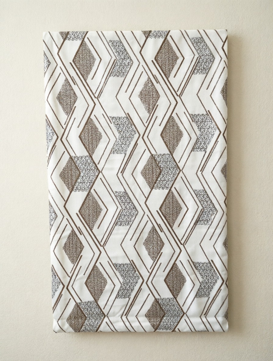 Patterned Roman Shades in white linen with taupe geometric diamond embroidery and raised textured stitching