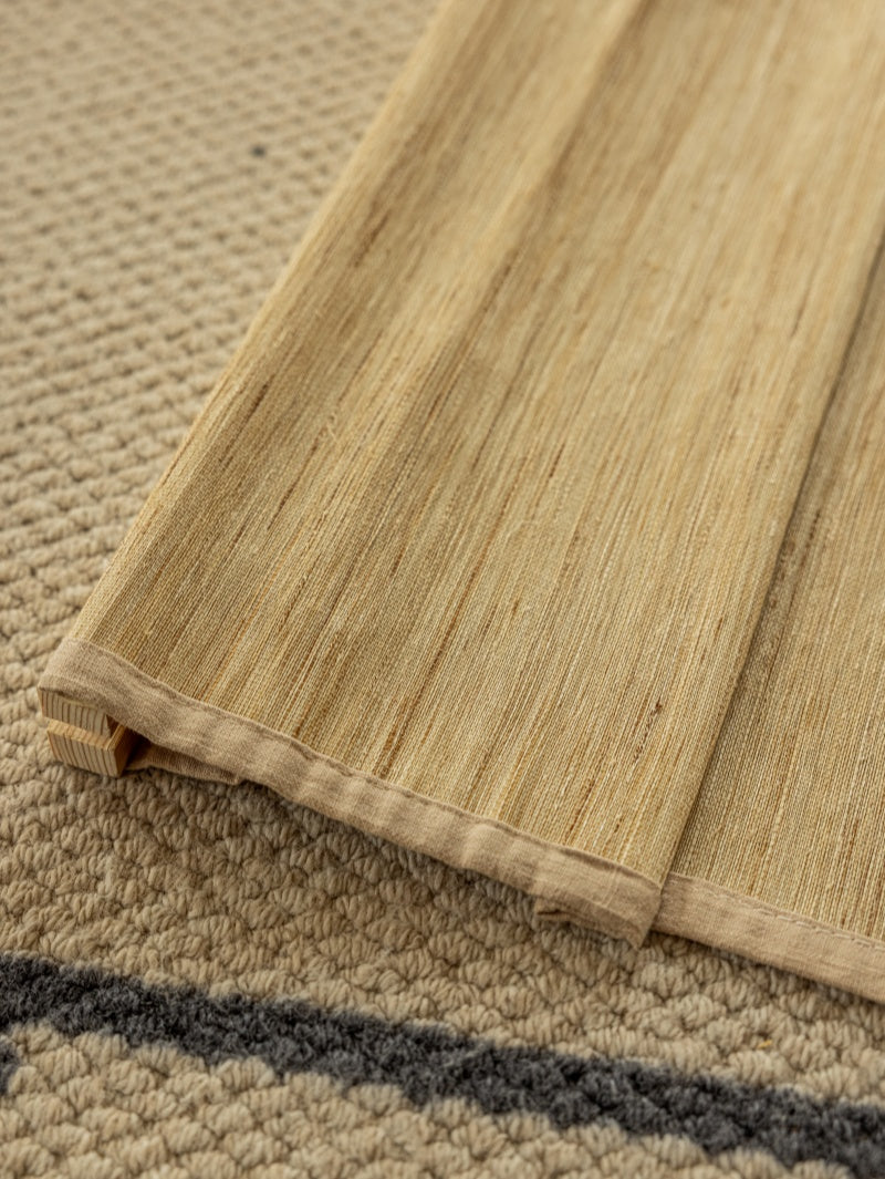 Natural custom bamboo shades in cashew with mildew-resistant ramie weave, soft texture, and handmade craftsmanship