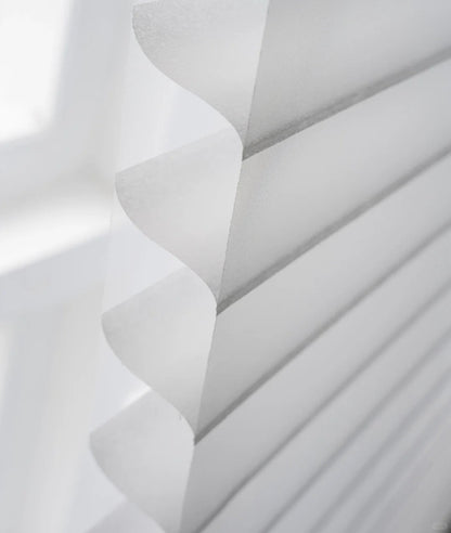Light-filtering corded Shangri-La sheer shades with adjustable horizontal fabric blades for privacy and soft light enhancement in large windows