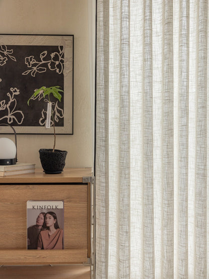 Elegant premium sheer linen curtains filtering soft sunlight in living room window