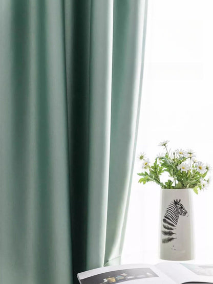 Luxurious heavyweight silk curtains with smooth draping and light-reflective texture in a vintage room setting
