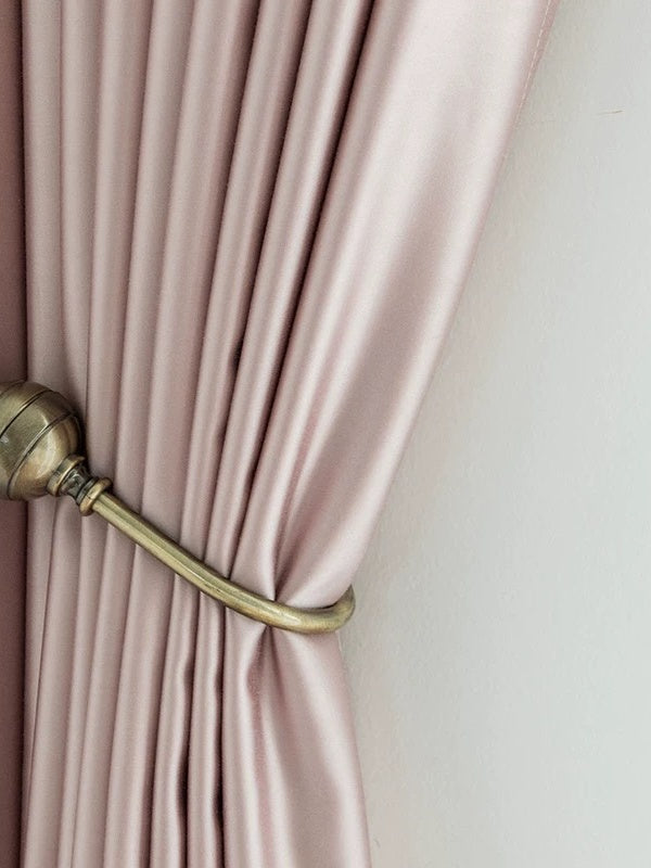 Luxurious heavyweight silk curtains glowing with light and smooth draping in a traditional room setting