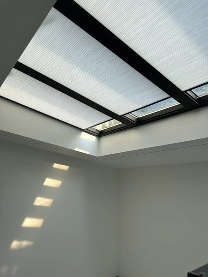 Aluminum-framed 1" honeycomb cellular skylight blinds with steel wire tension system and motorized remote control option
