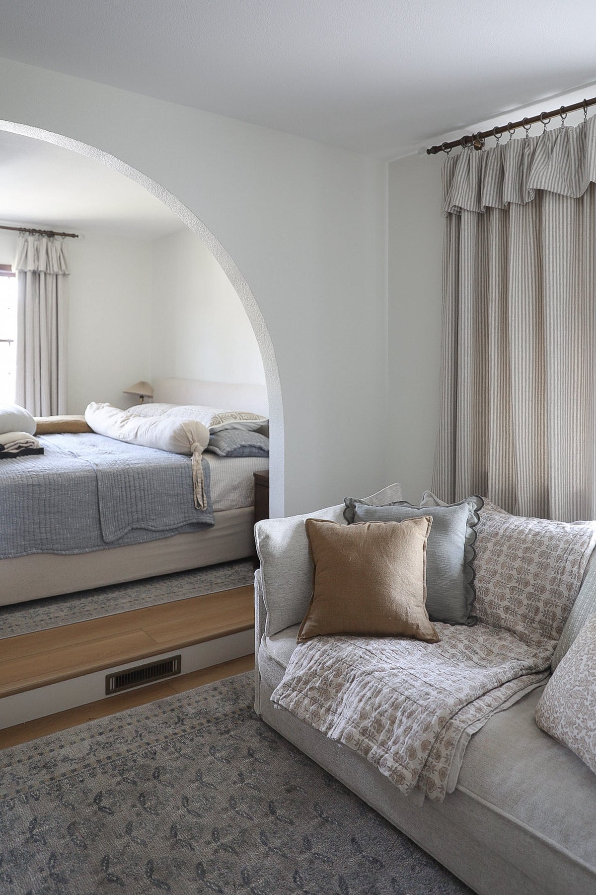 Striped Curtains in soft beige linen with fine vertical stripes and a gathered ruffled top header