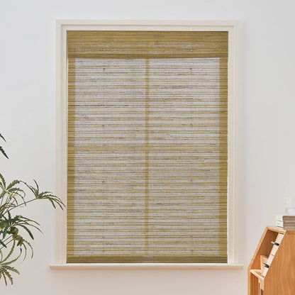 Natural hemp outdoor bamboo shades in beige brown with Roman design in window setting.