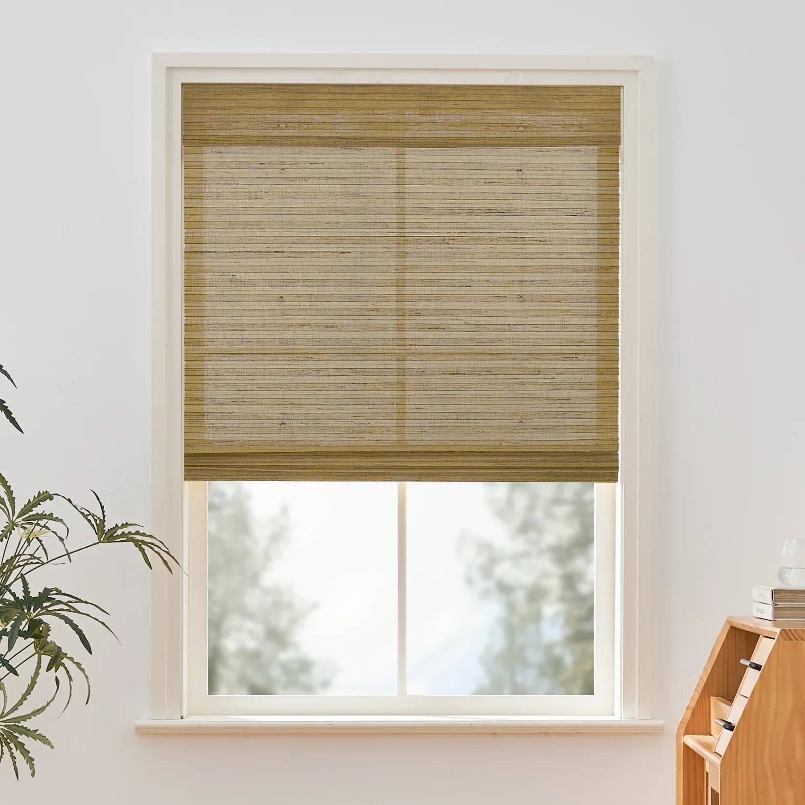 Natural Jute Bamboo Outdoor Shades in oak hue installed on a window, showcasing woven texture and sunlight diffusion.