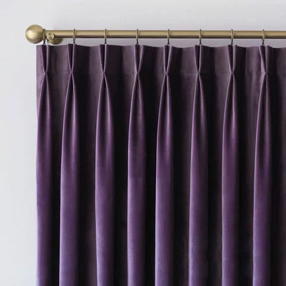 Luxurious soft sheen velvet drapes in deep rich colors enhancing living room and bedroom interiors