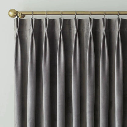 Luxurious soft sheen velvet drapes in rich colors enhancing living room and bedroom interiors