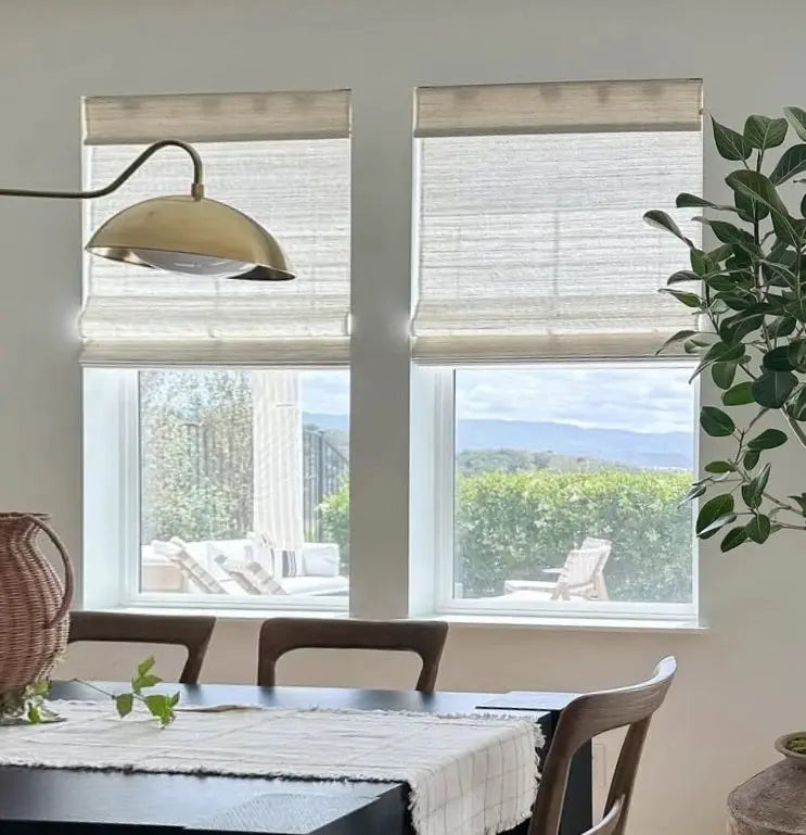 Natural ramie bamboo window shades in coconut white in an elegant dining room setting.