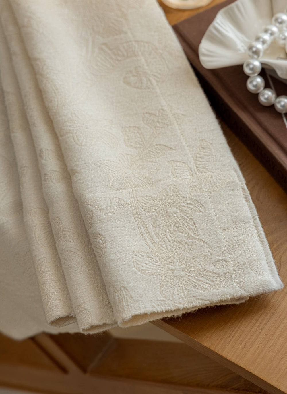White blackout curtains with embossed French floral pattern for elegant living room decor