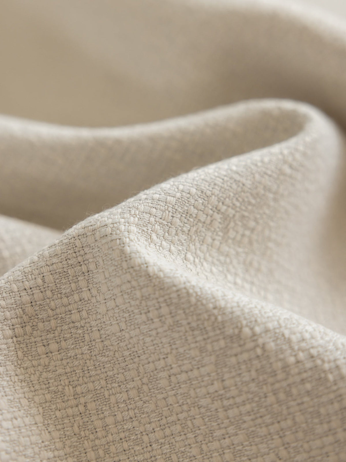 Linen blackout curtains for bedroom in Morandi beige styled in a modern bedroom setting.