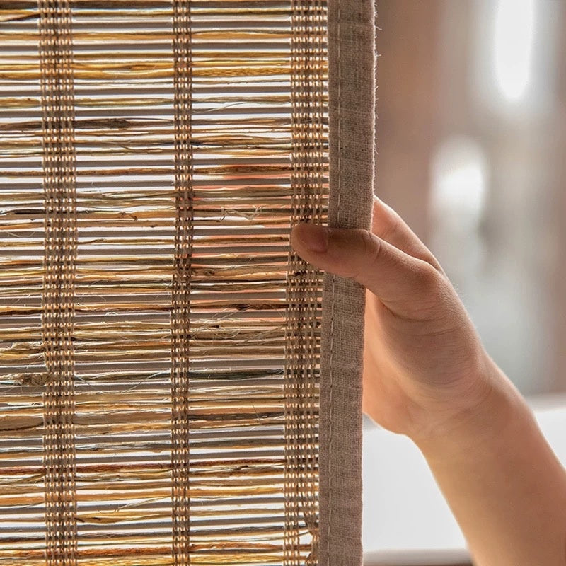 Woven Roman Shades in natural cinnamon jute with an open handwoven texture and visible organic variation