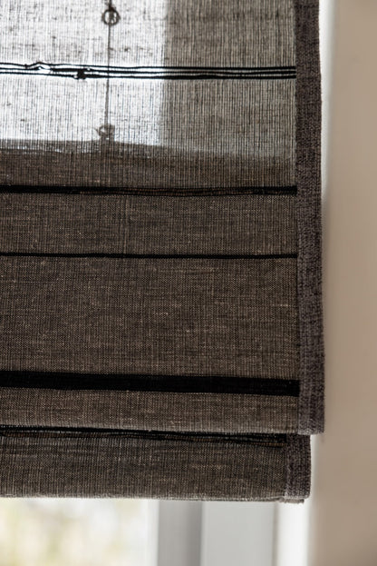 Black striped woven shades made from natural ramie and bamboo with breathable, mildew-resistant handcrafted texture